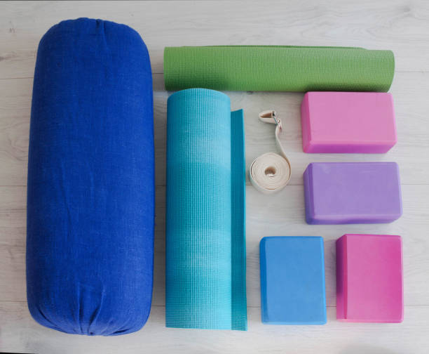 istock yoga props blocks, strap, roller and carpet 1533456396