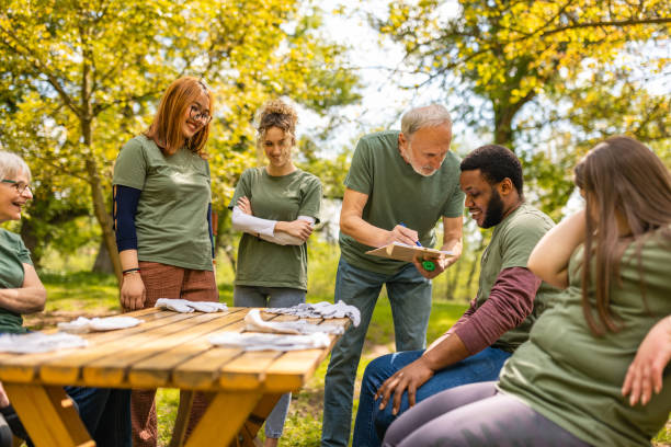istock Group of activists taking a break from collecting garbage 1533457718