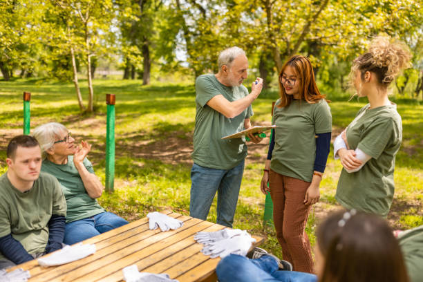 istock Group of activists taking a break from collecting garbage 1533459317