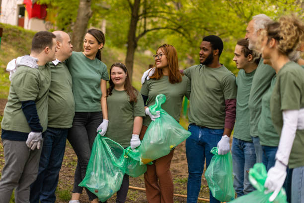istock Group of volunteers embracing after a successful forest cleanup 1533472461