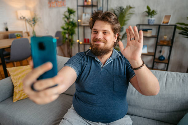 istock Young Man Having A Video Call At Home 1533504891