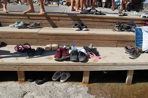 View of shoes and footwear on pool side
