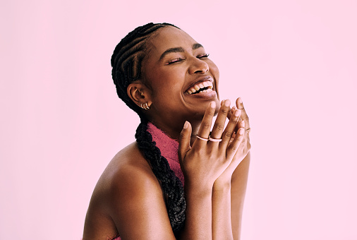 beauty shot of  beautiful black woman in monochromatic pink. Stock photo, copy space