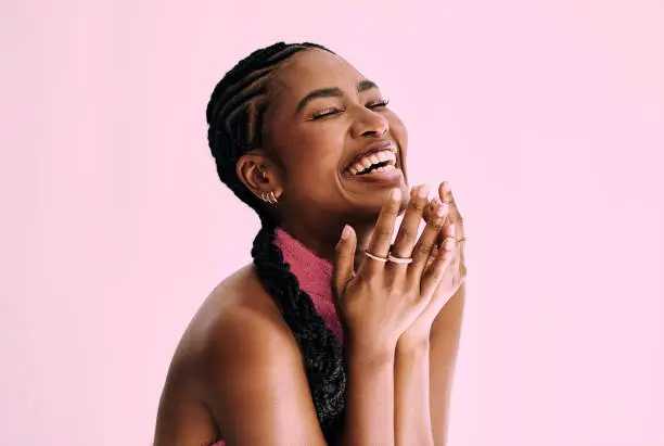 Photo of beauty shot of  beautiful black woman in monochromatic pink. Stock photo, copy space