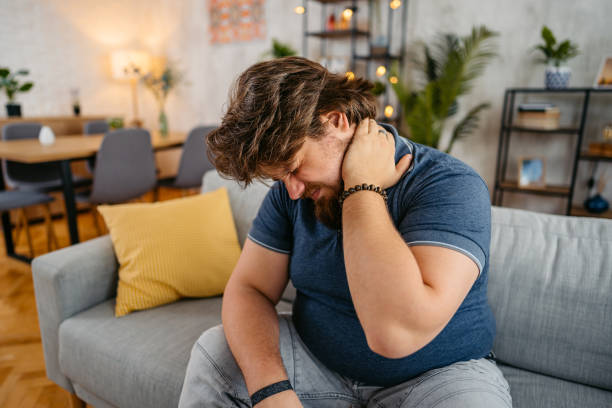 istock Young Man Having Neck Pain At Home 1533538766
