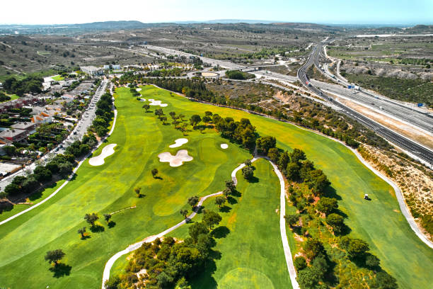 istock Drone point of view golf course during sunny summer day 1533553063