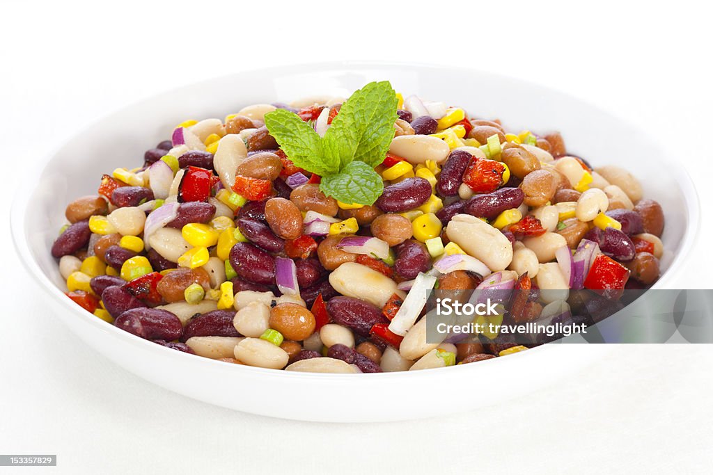 Three Bean Salad Three bean salad with sweetcorn, roasted red peppers and red onion in a vinaigrette dresing. Kidney Bean Stock Photo