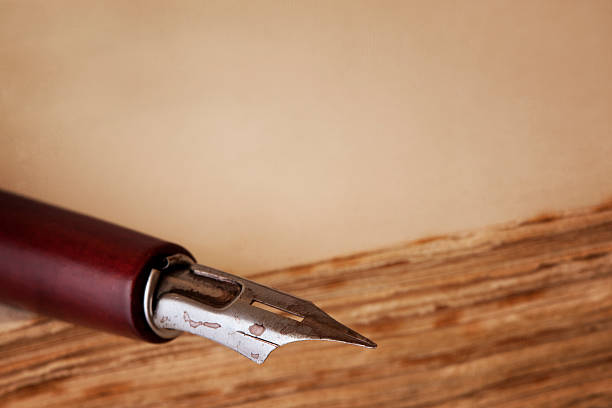 istock Nib Pen on Old Book with Copy Space 153359524