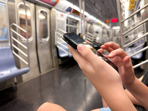 Using phone in subway