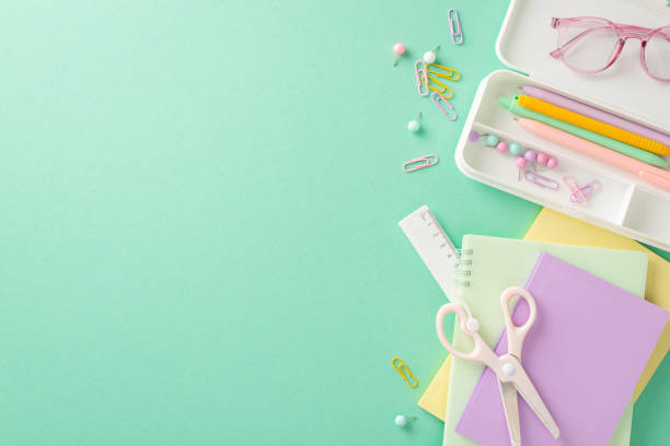 istock Dive into the educational process with this top-view shot displaying glasses and collection of school supplies on isolated pastel blue backdrop, copy-space allows for personalized text or promotions 1533608387