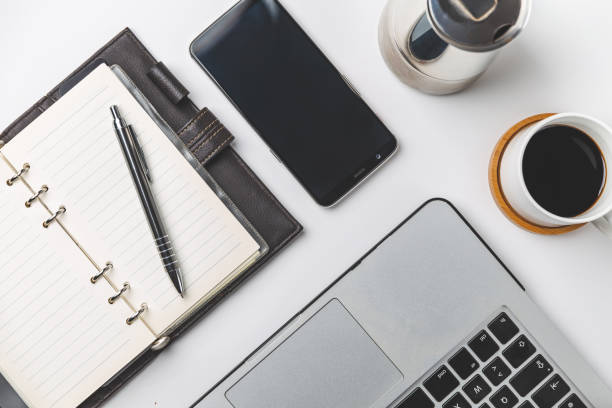 istock close up of smartphone, laptop, note, and coffee cup 1533610583
