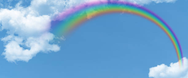 istock white cloud and blue sky and  rainbow background with copy space 1533618344