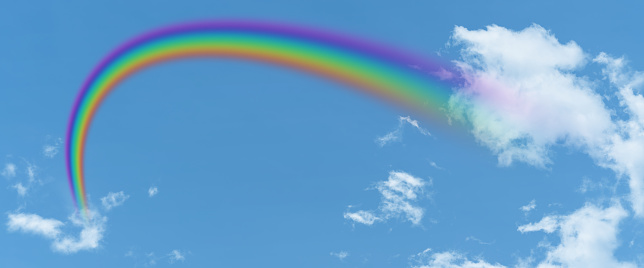 white cloud and blue sky and  rainbow background with copy space