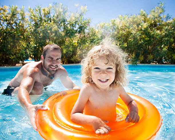 istock Happy child playing with father 153362600