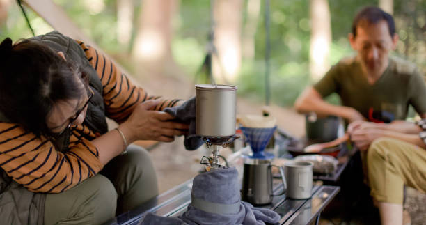 istock Brewing coffee early in the forest camping 1533628223