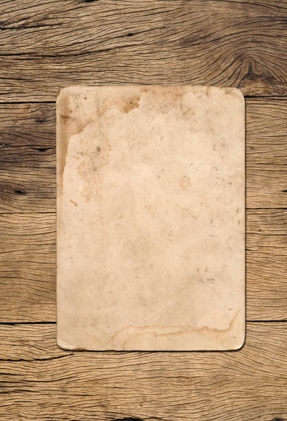 istock Old paper texture background on wood board 1533628552
