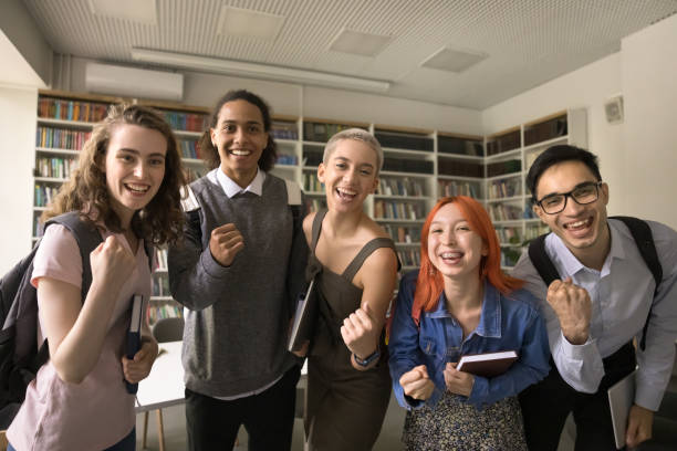 istock Cheerful excited high school mates celebrating educational achievement 1533629102
