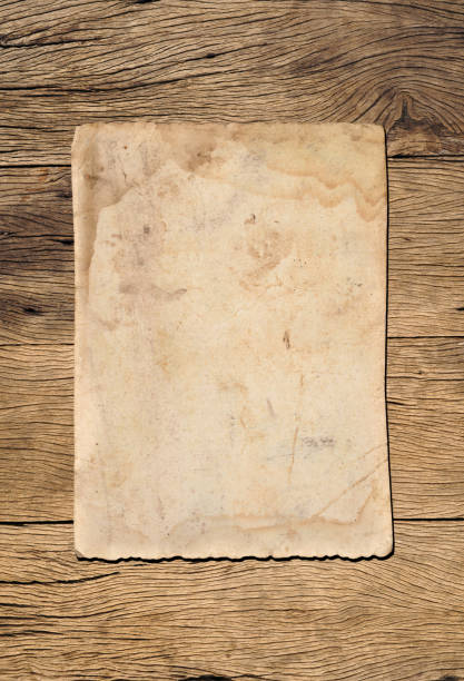 istock Old paper texture background on wood board 1533630807