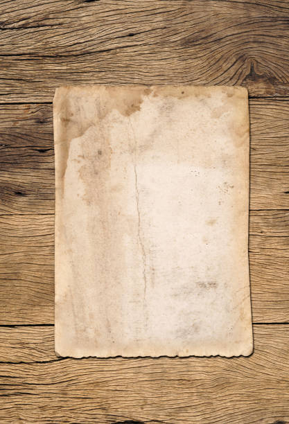 istock Old paper texture background on wood board 1533630813