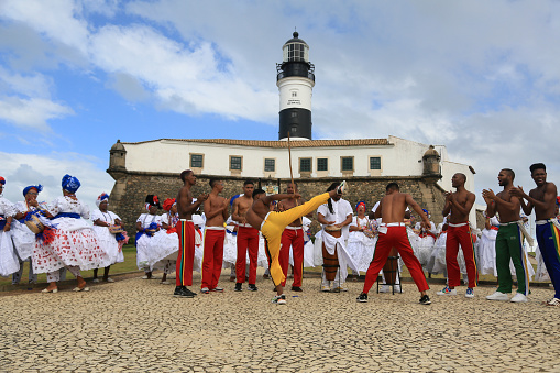 salvador, bahia, brazil - july 4, 2023: capoeiristas perform at Farol da Barra during the launch of the Chinese automaker BYD factory, which will open a factory in the city of Camacari.
