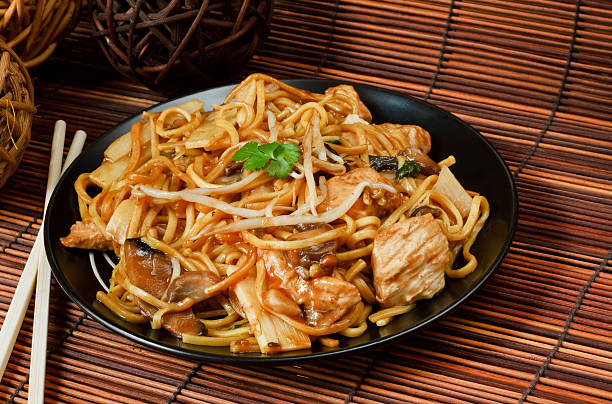 istock Chicken chow mein on bamboo mat with chopsticks 153363435