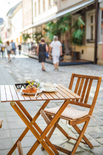 Coffee and croissants on cafe's summer terrace
