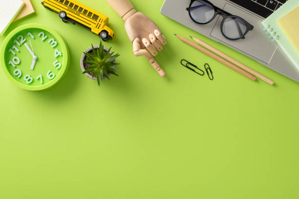 istock Immerse yourself in the digital learning era with this top-view composition, featuring a laptop and school essentials on light green backdrop. The empty space is perfect for text or advertising 1533646048