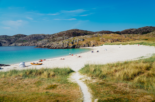 Achmelvich beach near the village of Lochinver. What you will see if you take the North Coast 500 road trip.