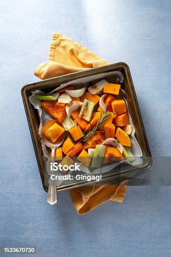 istock Pumpkin soup. Butternut squash and vegetables ready to be baked in baking tray. 1533670730