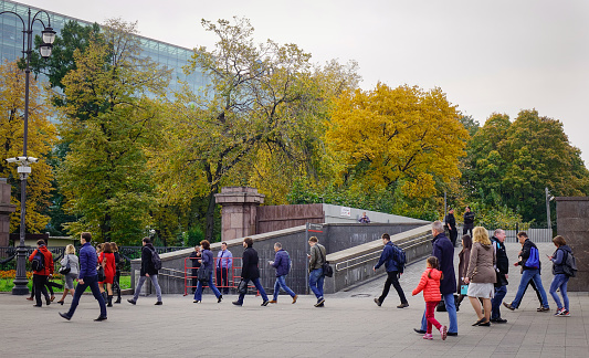 Moscow, Russia - Oct 3, 2016. People walking at autumn park in Moscow, Russia. Moscow is the capital and most populous city of Russia, with 13.2 million residents.