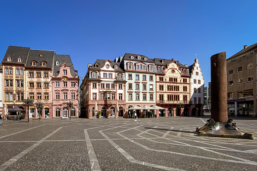 Market square with market houses in Mainz, Germany against blue sky