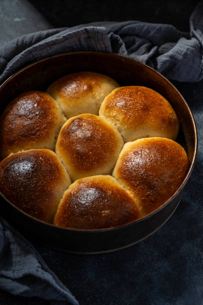 istock Sourdough buns in a baking round pan, dark background 1533690528