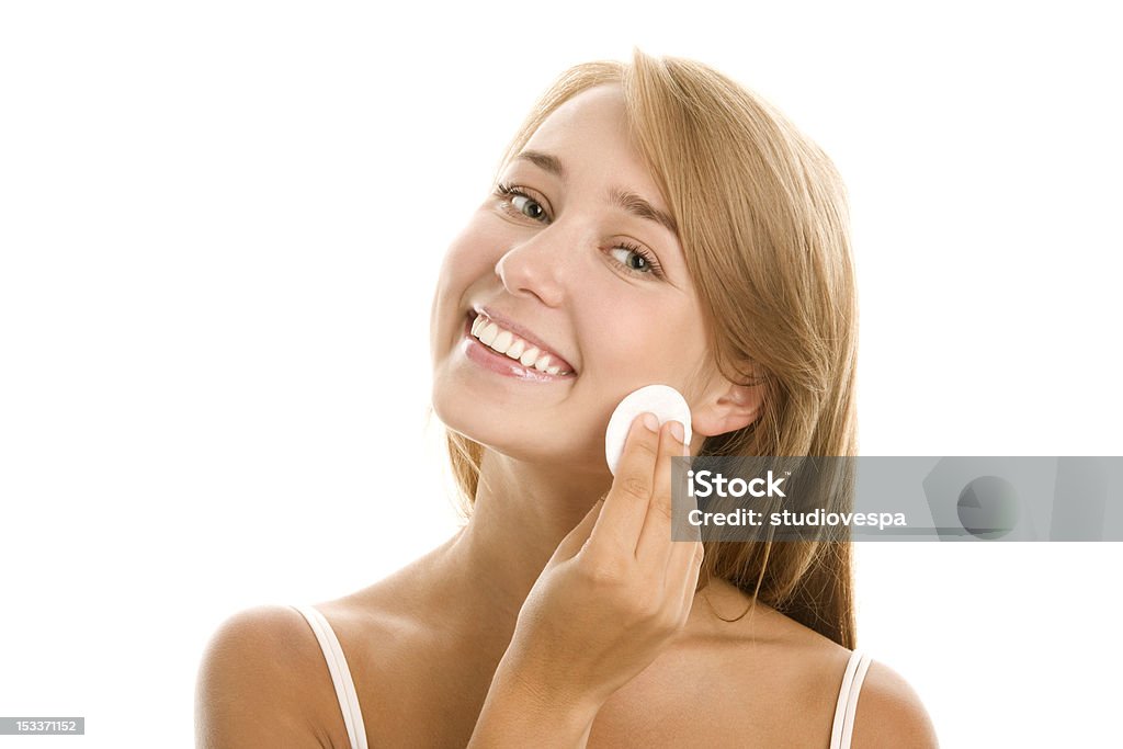 Young woman using cleansing pad Woman removing makeup with cosmetics pad 18-19 Years Stock Photo