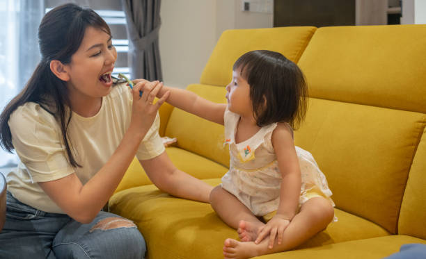 istock Togetherness concept. Mom and daughter playing together 1533717030