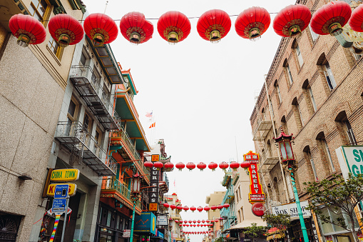 March 18, 2023: walking the Chinatown of San Francisco, California with Chinese lamps, stores, hotels, restaurants and traditional boutiques