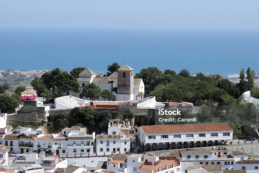 View of town with sea to rear, Mijas, Spain. View of the towns church (The Immaculate Conception (Iglesia de la Inmaculada Concepcion)) and bullring with the sea to the rear, Mijas, Costa del Sol, Malaga Province, Andalusia, Spain, Western Europe. Mijas Stock Photo