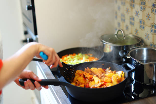 Mixing vegetables in pan closeup