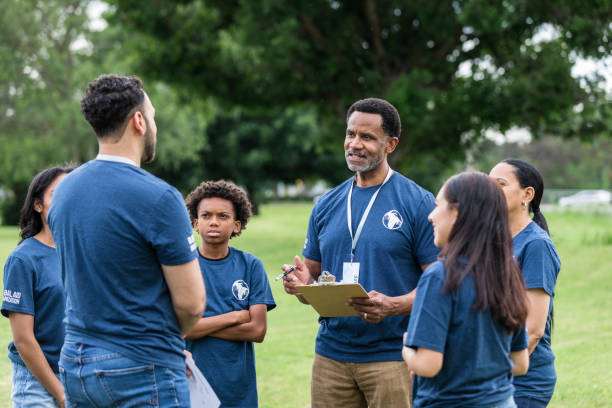 istock Unrecognizable young man talks to mature male event organizer 1533752137