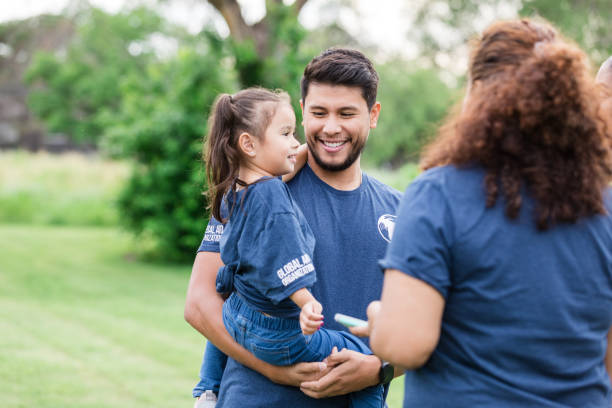 istock At park event, proud dad watches daughter 1533752684