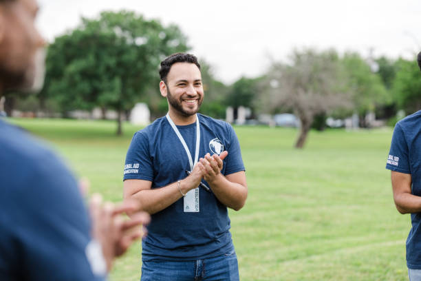 istock Young adult man claps and smiles at event 1533752685
