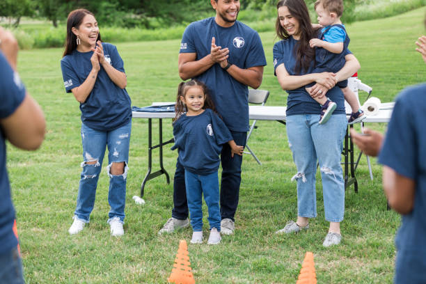 istock Multigenerational, diverse group of volunteers clap at event 1533752710