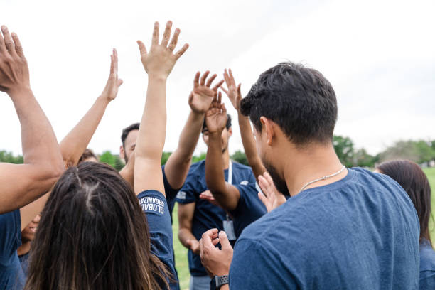 istock Unrecognizable adults shout and cheer after working together all day 1533752718