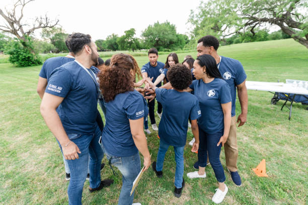 istock Multiracial group puts hands together and cheer 1533752720