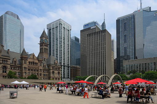 Toronto, Canada - July 1st, 2023: Nathan Phillips Square is a bustling public square located in the heart of downtown Toronto. It serves as the city's main gathering place and a focal point for civic events, celebrations, and cultural activities.