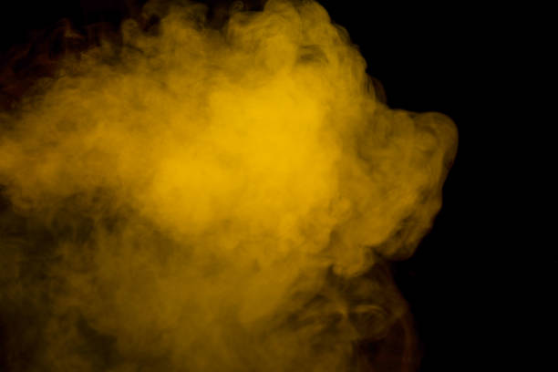 istock Yellow steam on a black background. 1533804222