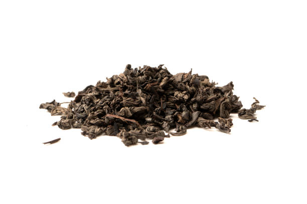 istock Dried tea leaves isolated on a white background. 1533804747
