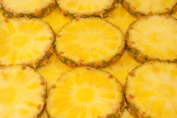 istock Pineapple juicy yellow slices as a background. 1533804807