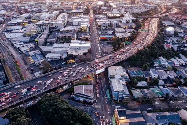 The motorway with much traffic in Newmarket with queues of cars to its ramp