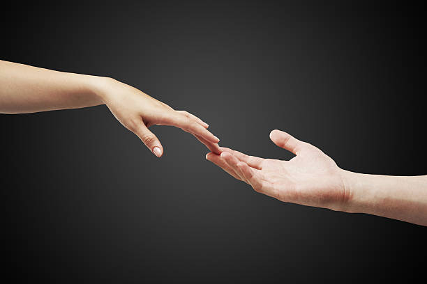 istock male and female hands (palms) stretch  to each other 153381996