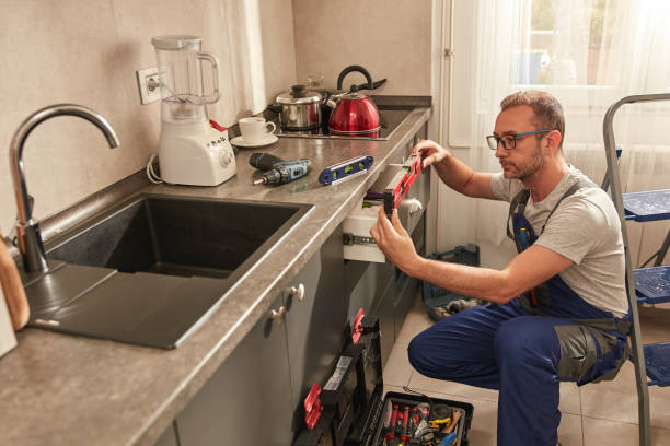 istock Handyman fixing kitchen cabinets in the apartment. 1533838677
